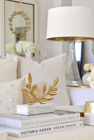 Modern living room with decorative cushions and abstract wall art