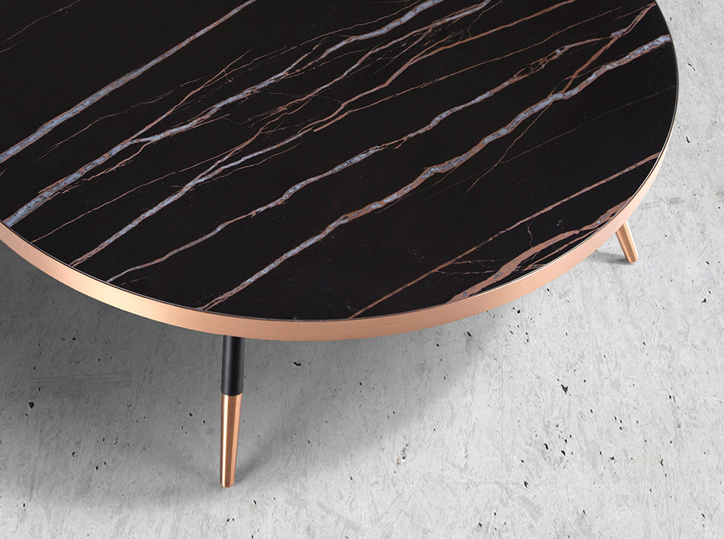 Porcelain black marble and steel round coffee table with bronze-colored chrome bath.