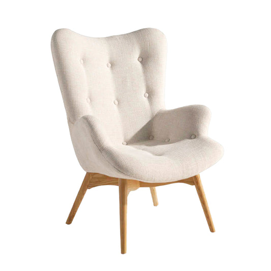 Armchair upholstered in tufted fabric