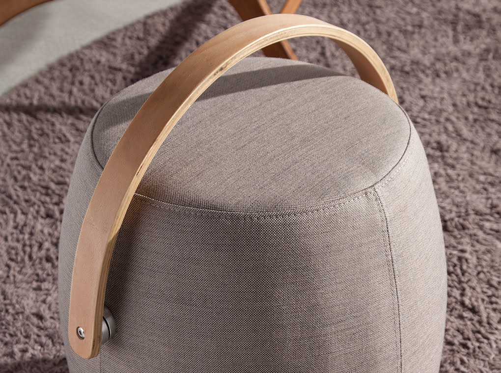 Puff upholstered in gray fabric