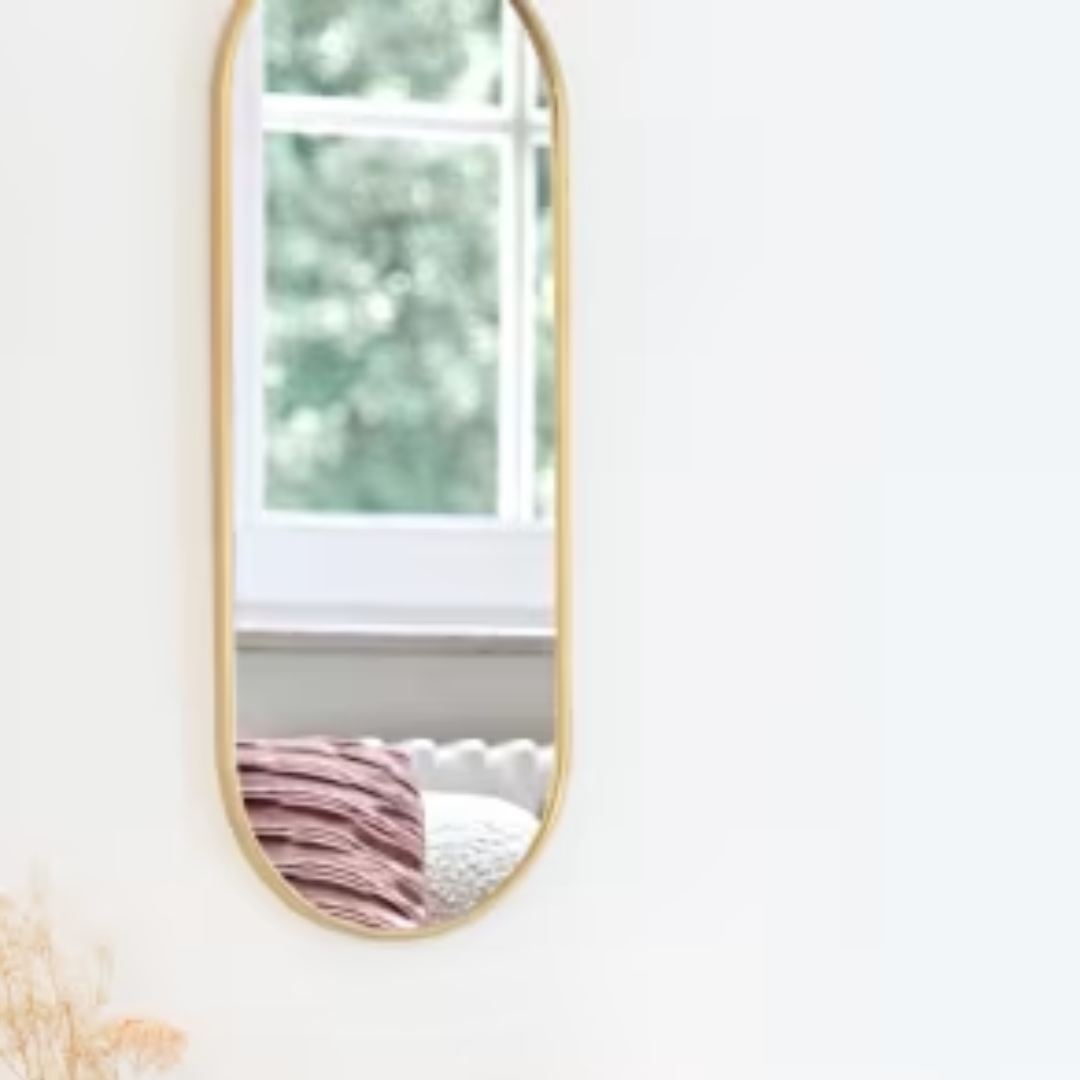 CAMBERA - Oval mirror in gold metal